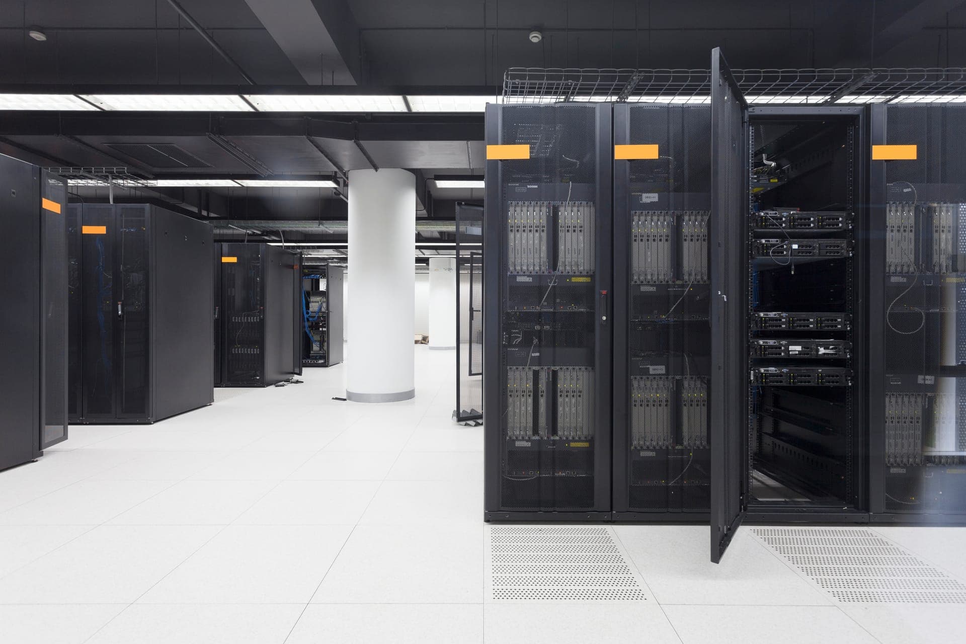 Data center with rows of illuminated server racks